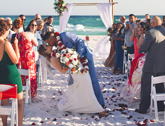 /Bride and groom on beach